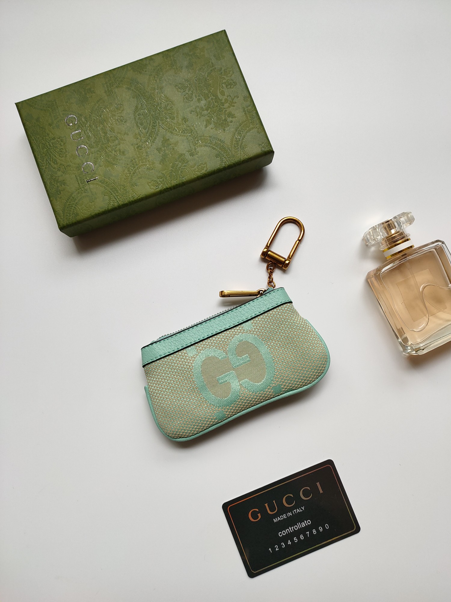 Gucci 小零钱包 - 大字布料と古銅双G金具のデザイン