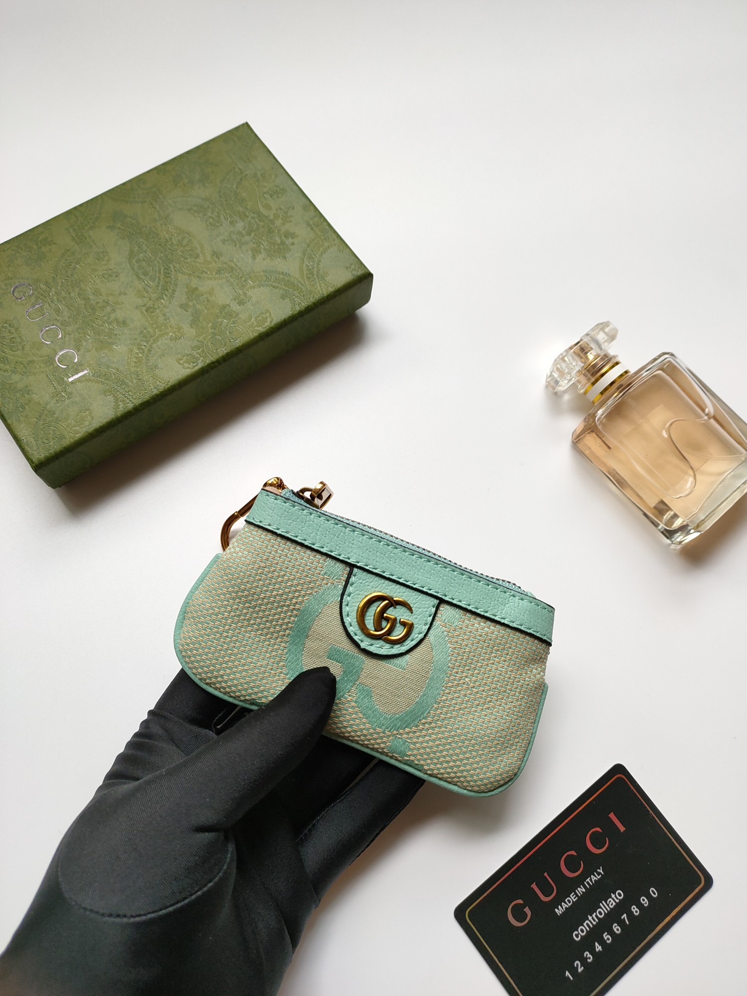 Gucci 小零钱包 - 大字布料と古銅双G金具のデザイン