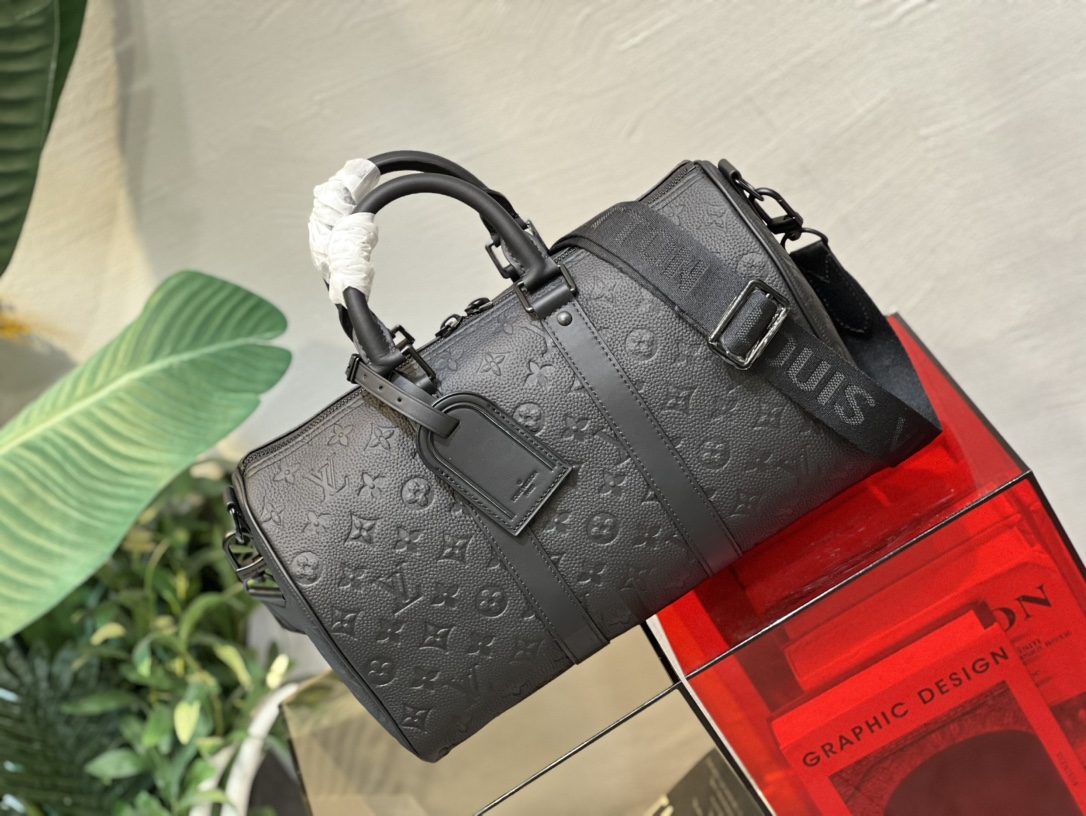This Keepall 35 travel bag is crafted from Monogram Shadow leather - Bag 2