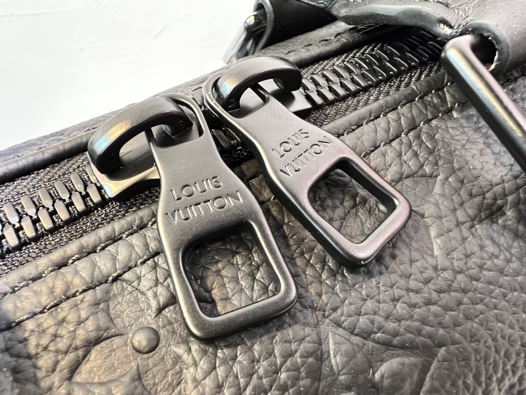 This Keepall 35 travel bag is crafted from Monogram Shadow leather - Bag 6