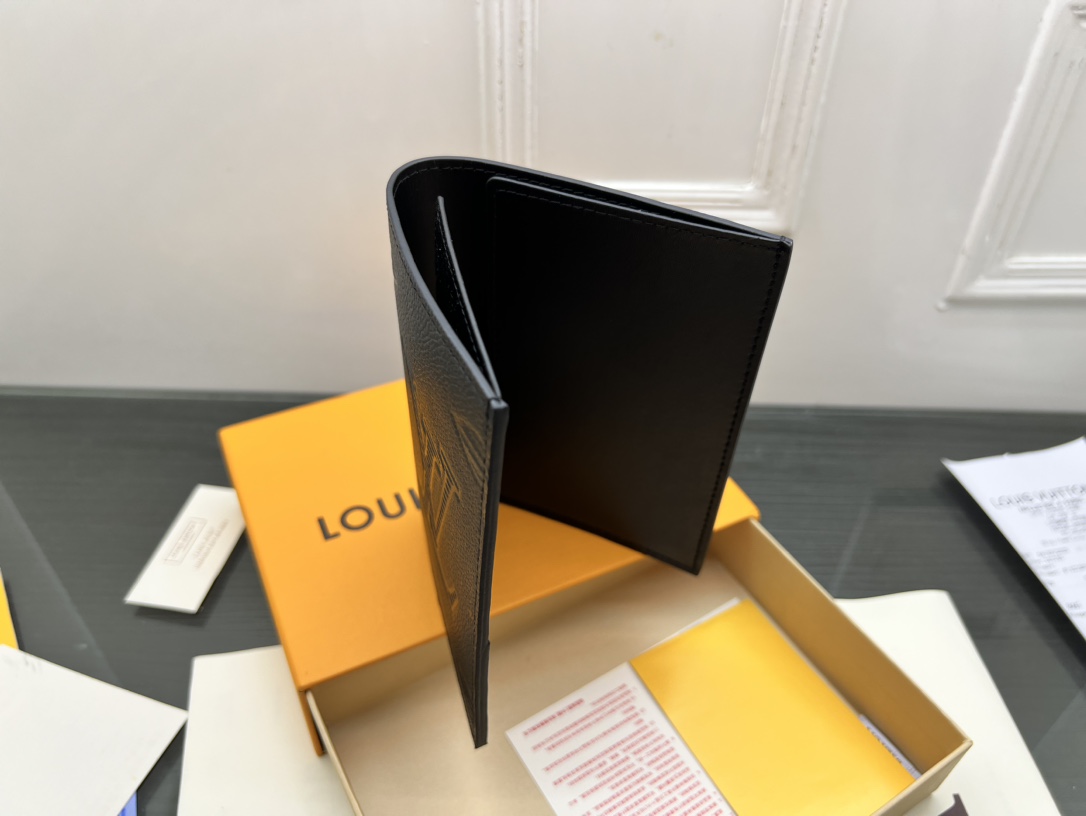 Close-up on the stitching of the leather passport holder