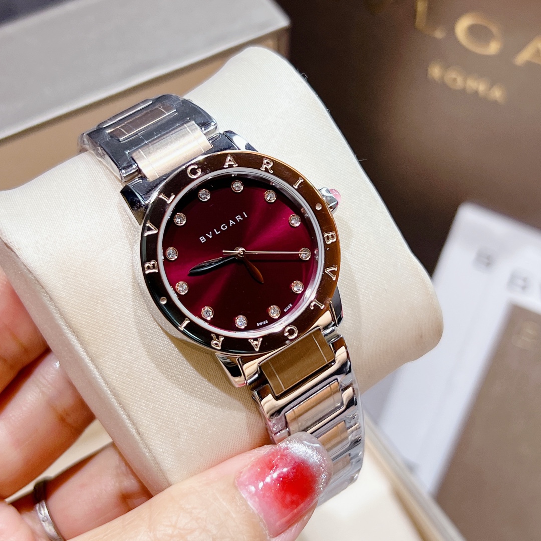 Bvlgari Bvlgari Bvlgari 33mm rose gold-tone case, brown bezel, burgundy dial, silver-tone bracelet 33mm Women's Quartz
