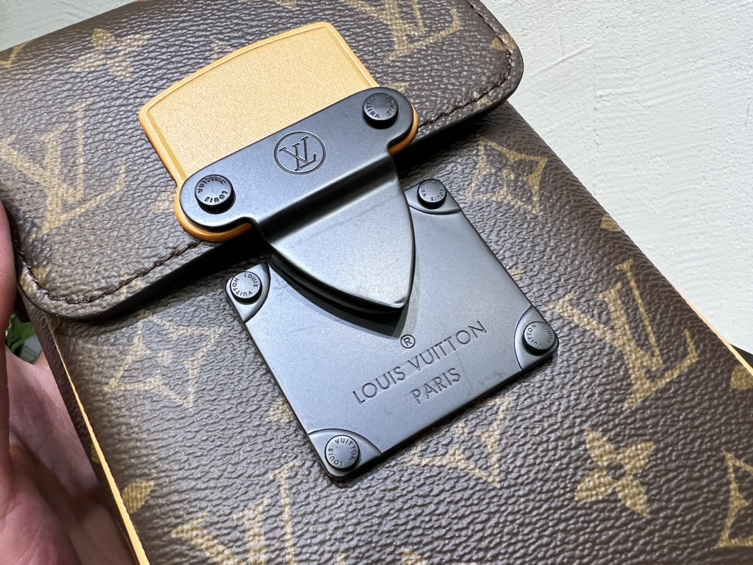 Crafted from Louis Vuitton's iconic Monogram Macassar canvas, the S-Lock - Bag 6