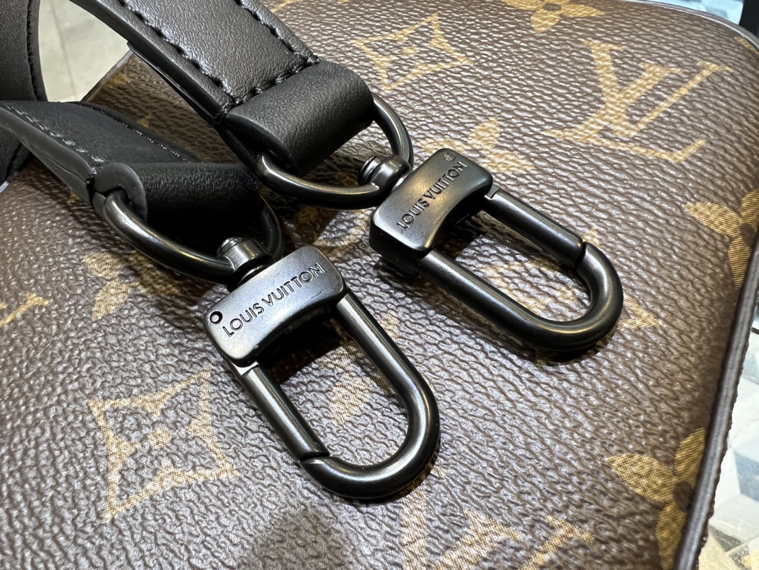 Crafted from Louis Vuitton's iconic Monogram Macassar canvas, the S-Lock - Bag 7
