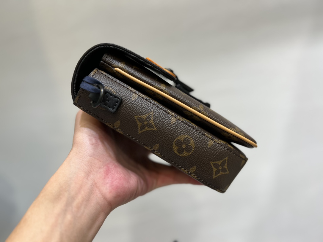 Crafted from Louis Vuitton's iconic Monogram Macassar canvas, the S-Lock - Bag 3