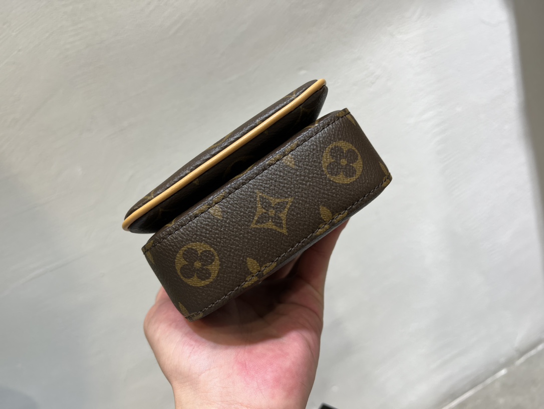 Crafted from Louis Vuitton's iconic Monogram Macassar canvas, the S-Lock - Bag 4
