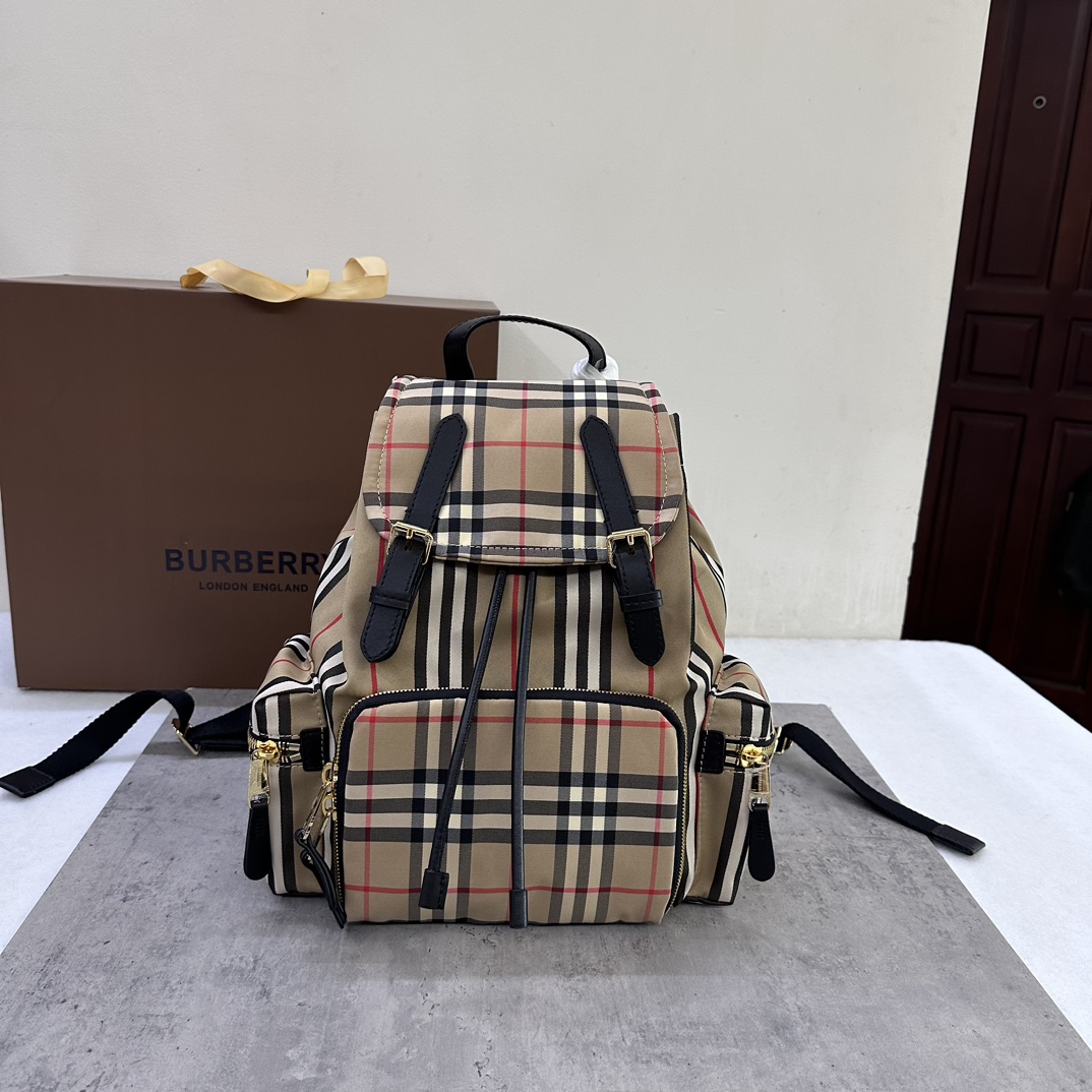 Burberry B Medium Vintage Stripe and Cowhide Military Backpack, crafted from plaid cotton fabric, decorated with topstitched cowhide trim, 3 zipp