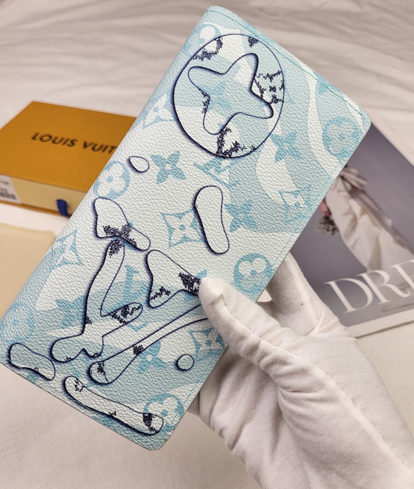 Mens leather bifold wallet held in a hand