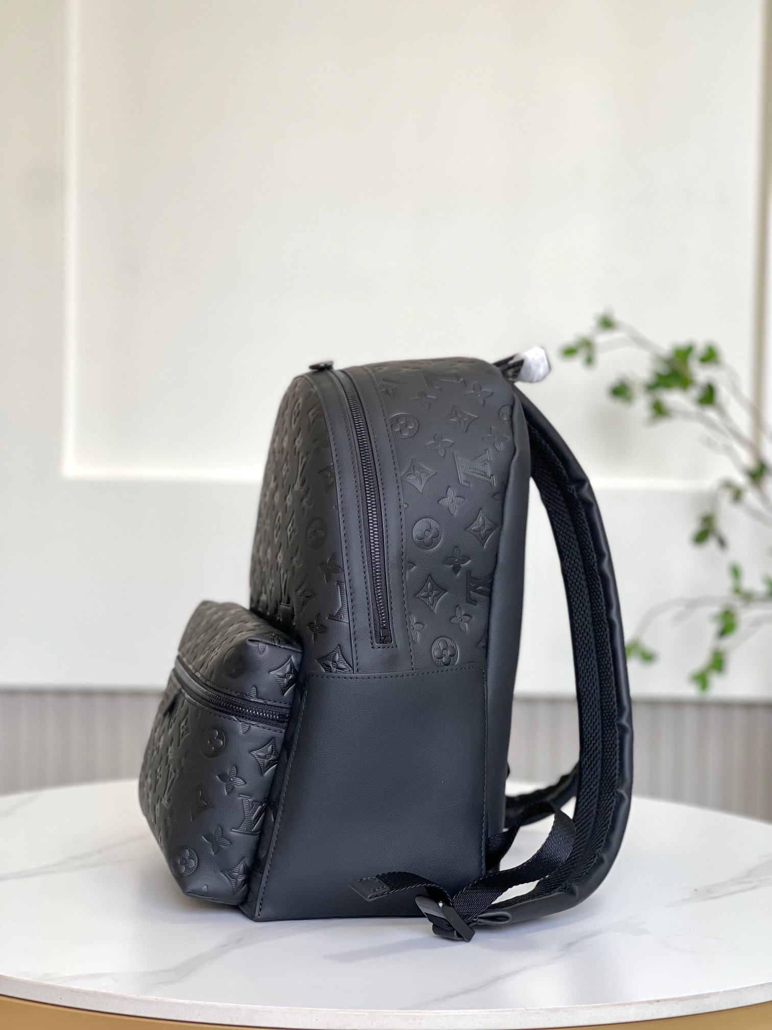 [Backpacks] This Discovery backpack is made of Monogram embossed cowhide leat