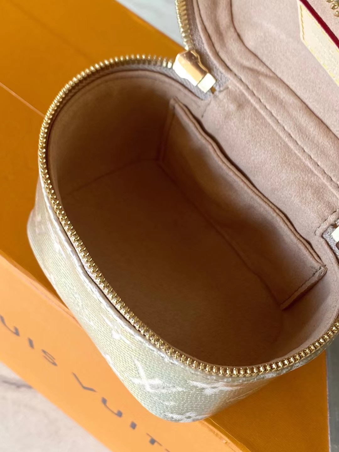this Micro Vanity handbag features a special coating that envelops its - Bag 9