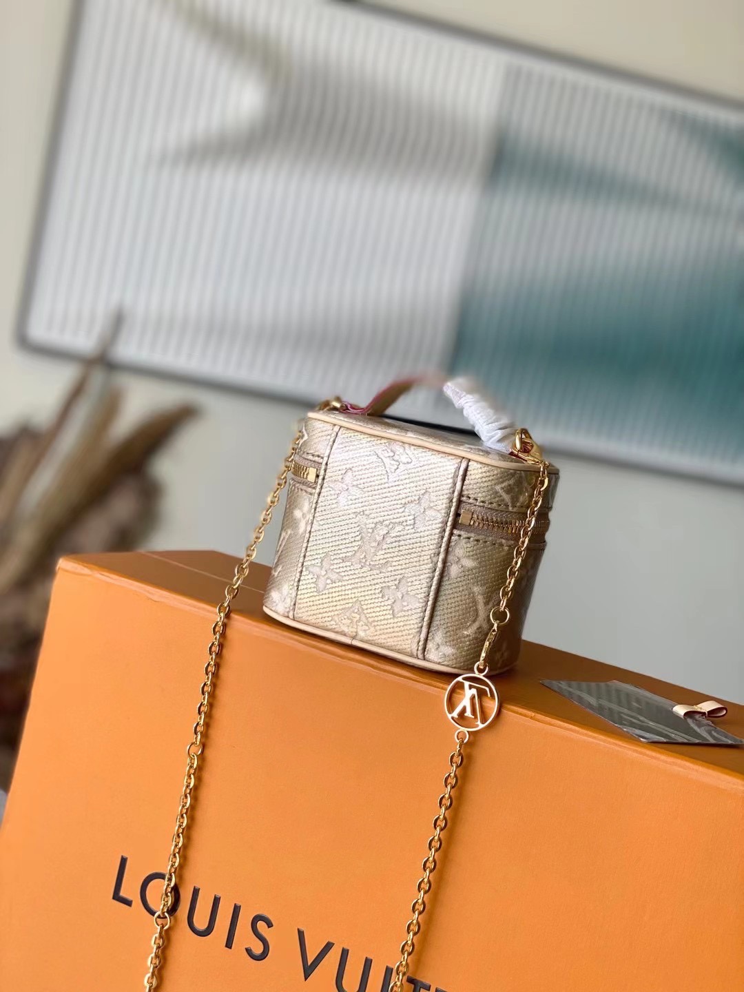 this Micro Vanity handbag features a special coating that envelops its - Bag 3