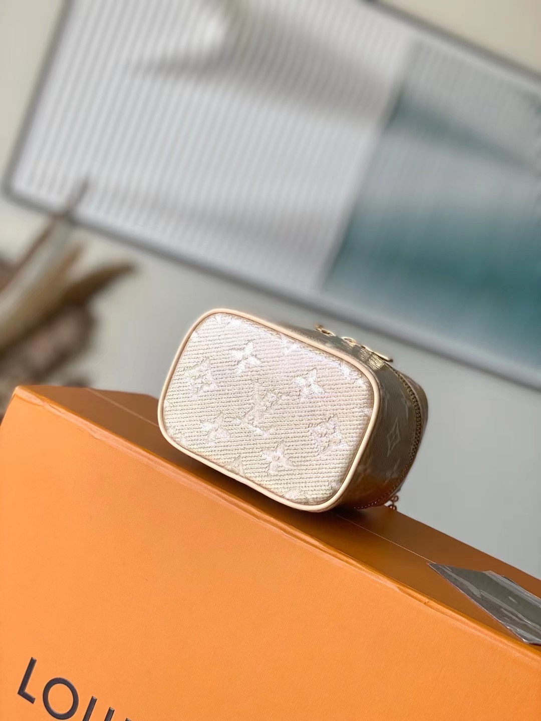 this Micro Vanity handbag features a special coating that envelops its - Bag 4