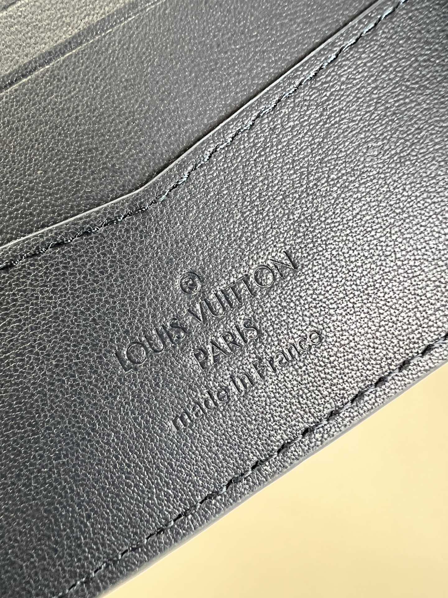 the Slender Wallet features a sleek silhouette that exudes timeless - Bag 5