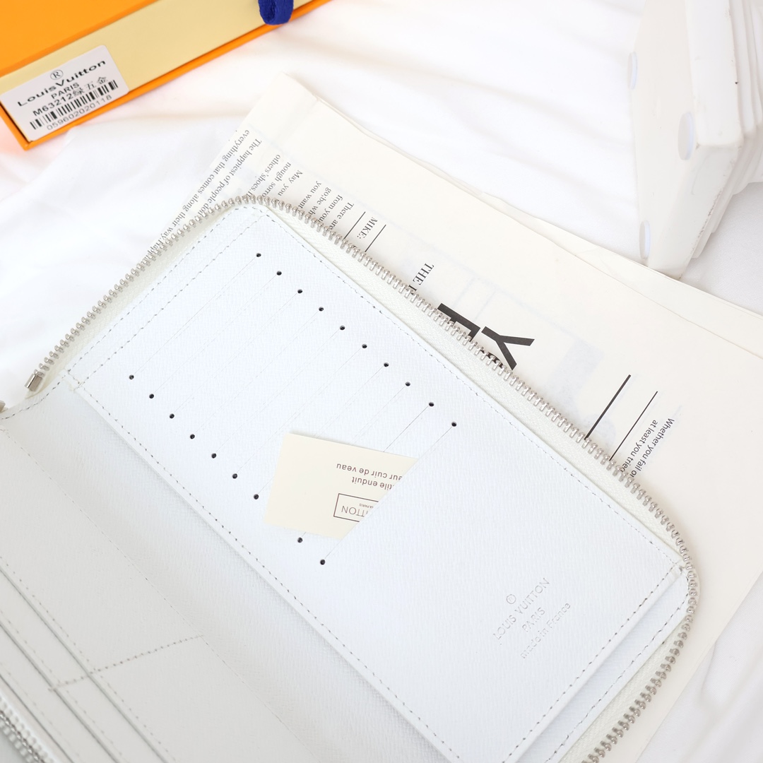 Leather wallet held in hand