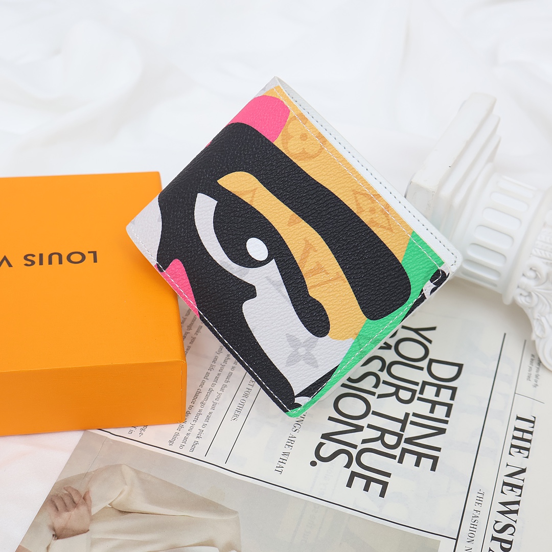 Man's hand holding a leather bifold wallet