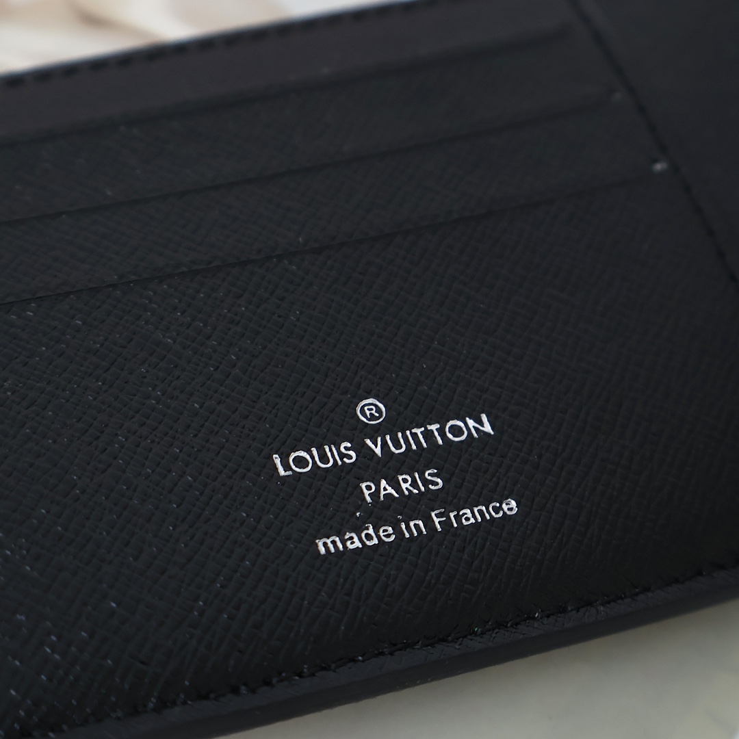 Close-up of stitching on the slim leather bifold wallet