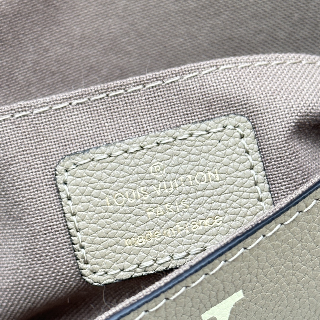 Leather wallet held as clutch