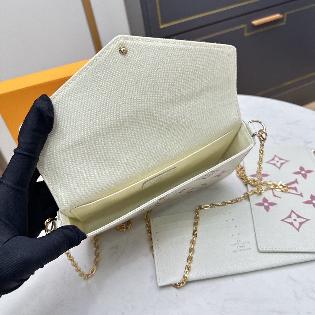 Leather wallet held as clutch