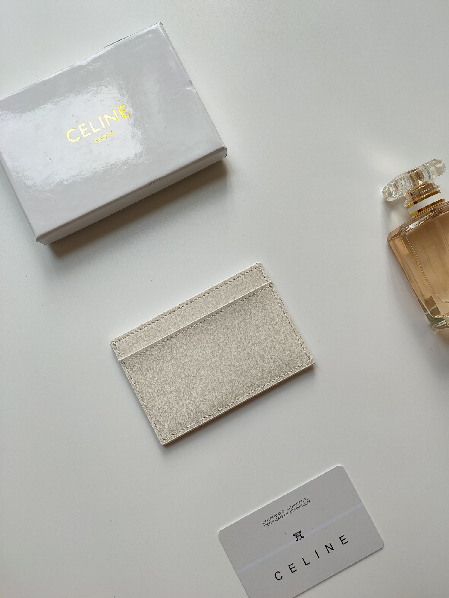Celine Triomphe card holder off-white smooth leather with matching tone embossed Triomphe logo 10 5 x 7cm