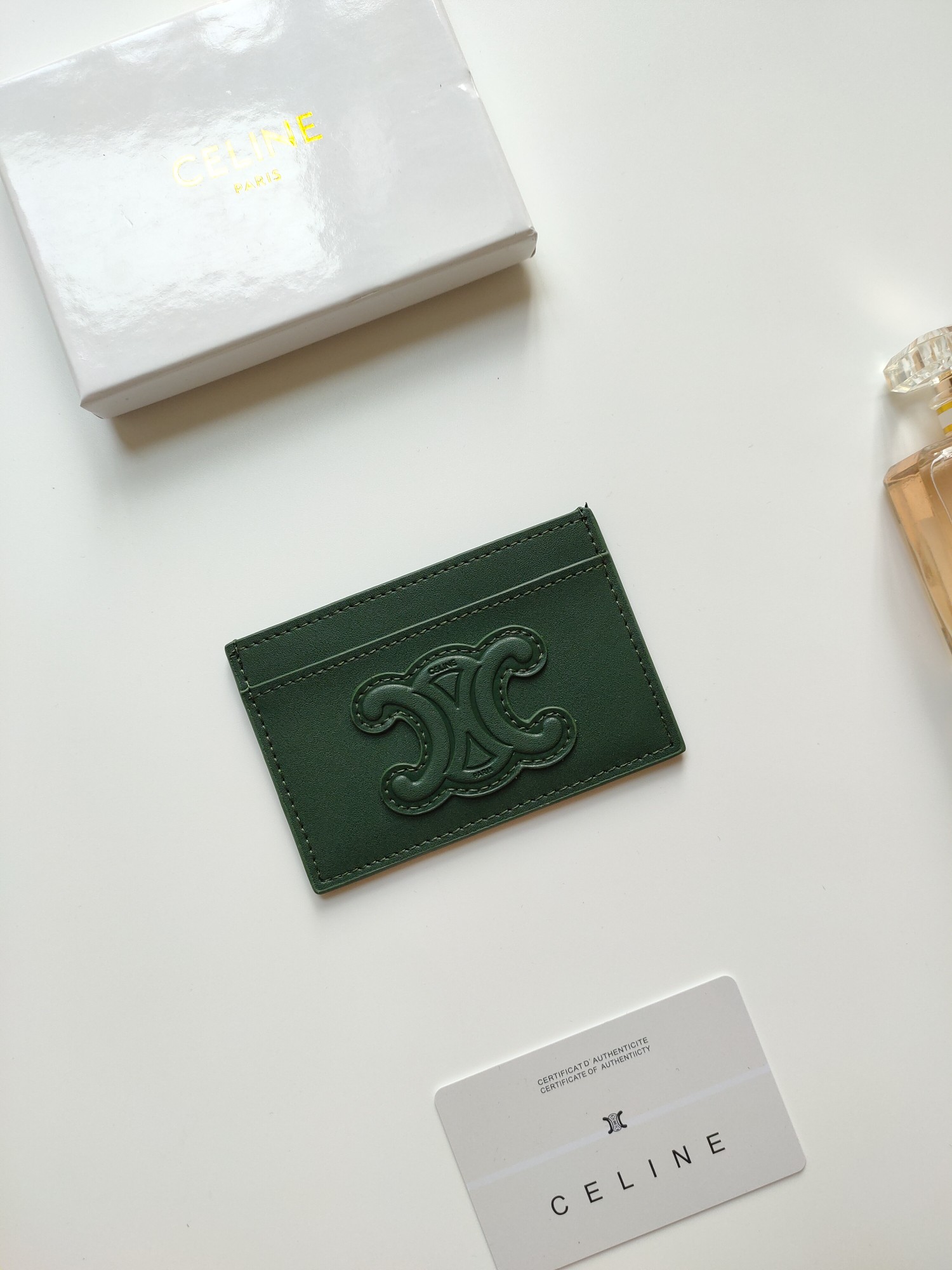 Celine Triomphe card holder dark green smooth leather no additional metal or stone accents 10 5 x 7cm