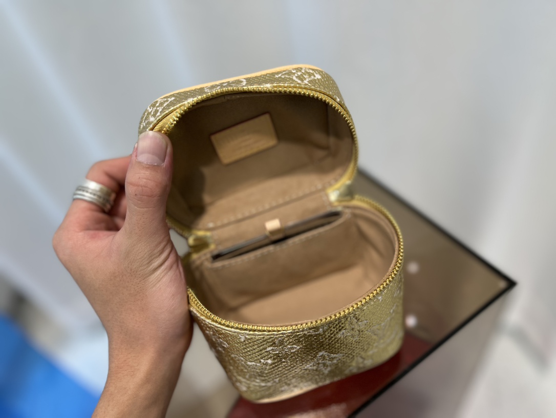 this Micro Vanity bag features a specialized coating that imparts a - Bag 8