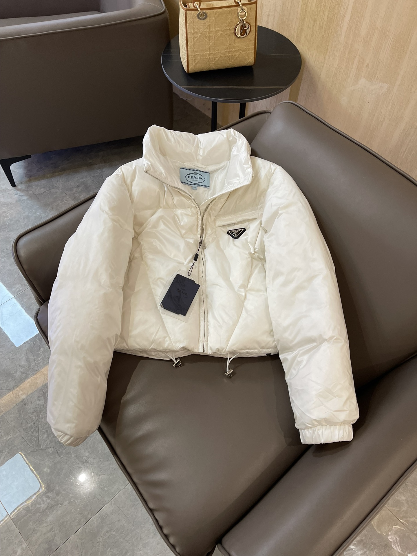 Prada triangle logo 90% white goose down short jacket in black, white, brown. Sizes 38-44.-Big cat