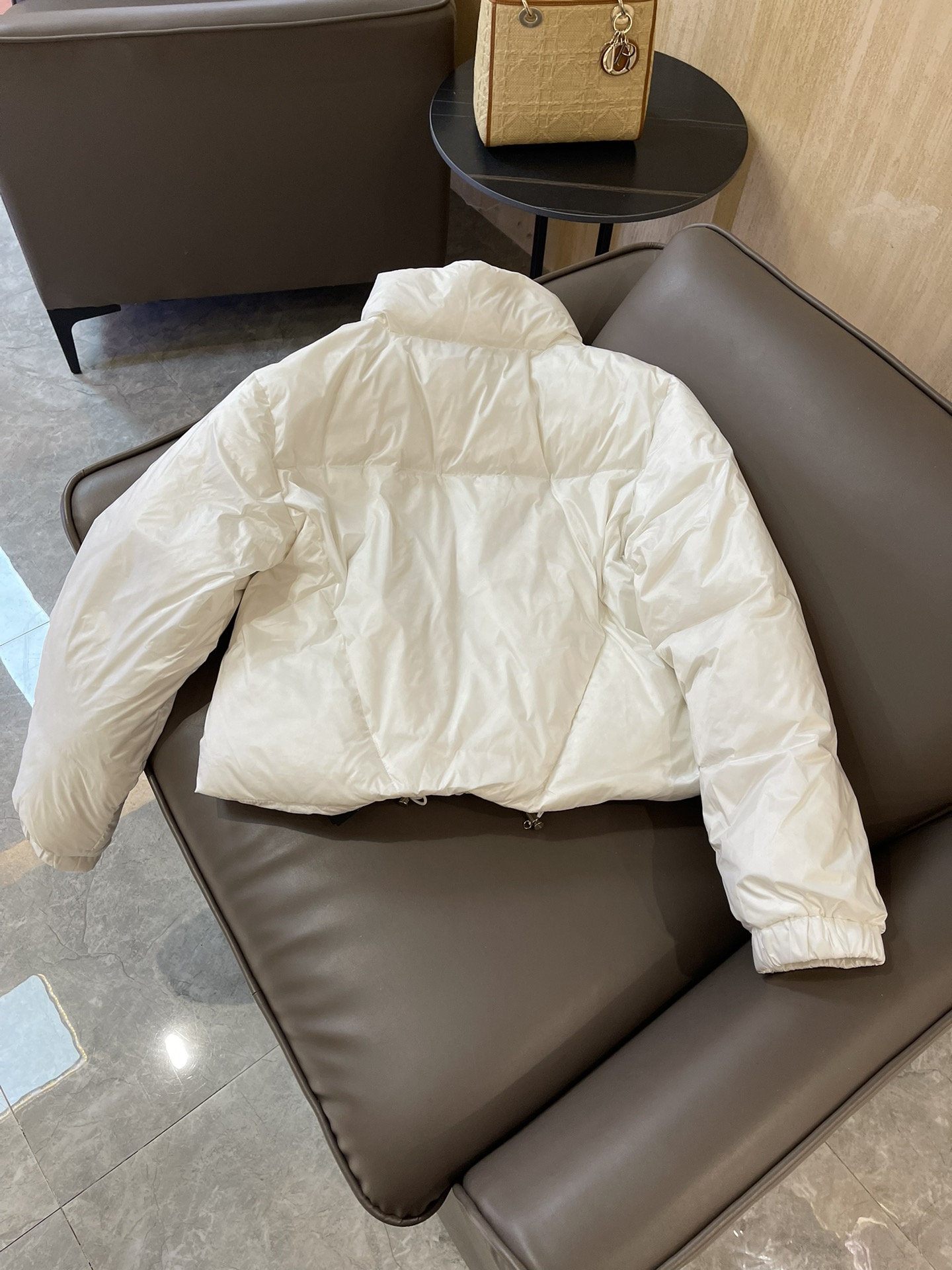 Prada triangle logo 90% white goose down short jacket in black, white, brown. Sizes 38-44.-Big cat