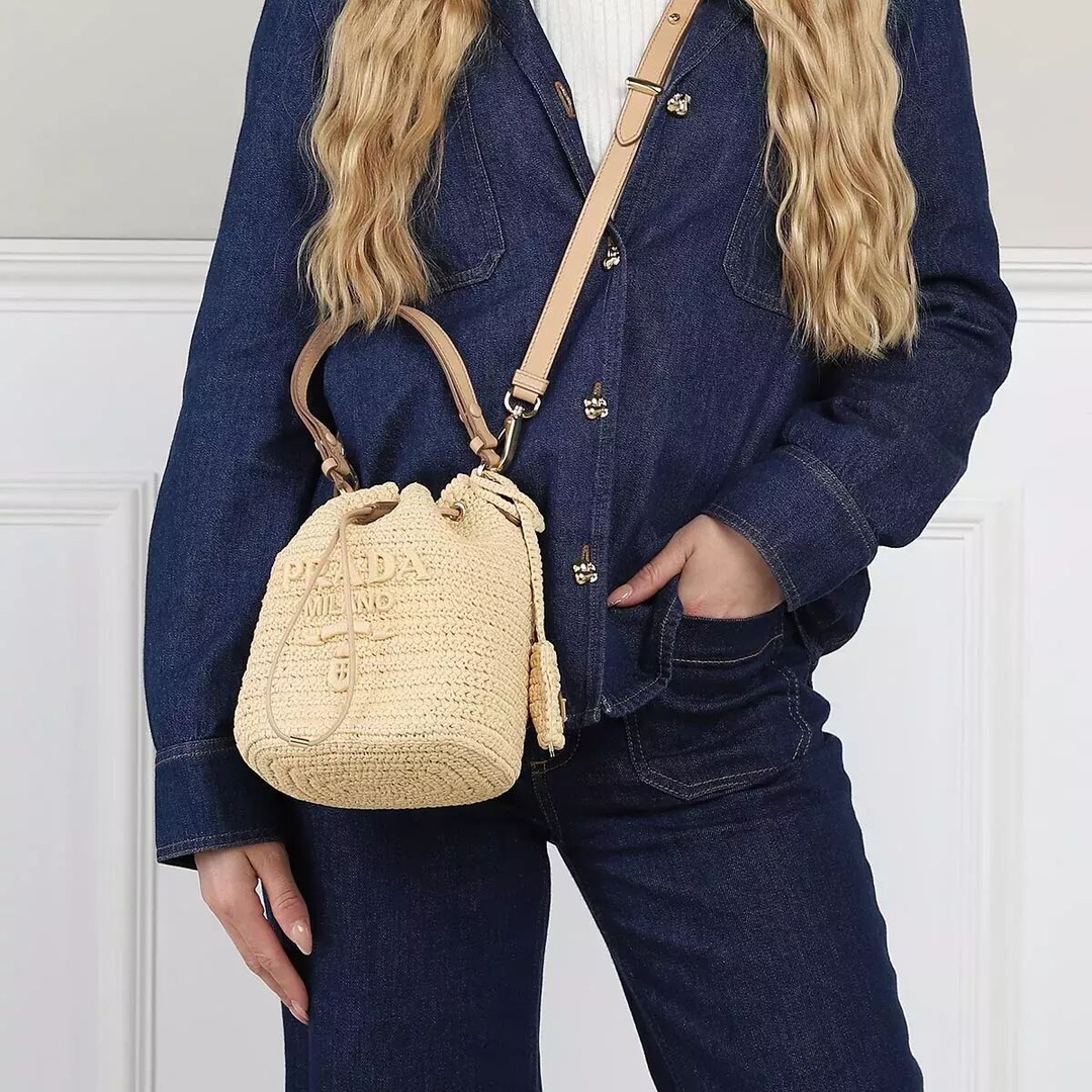 Prada Straw bucket, a must-have for vacation