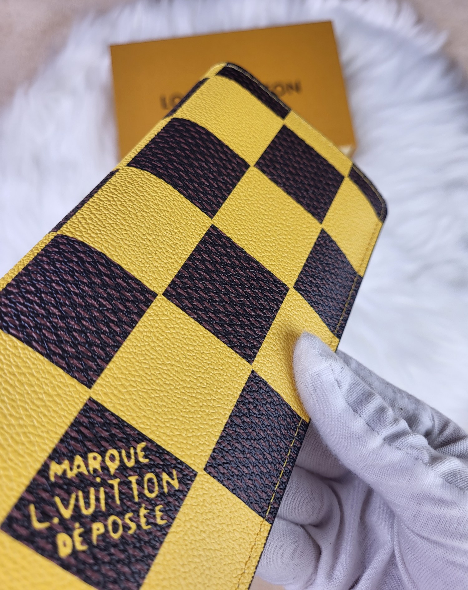 Person using luxury leather bifold wallet