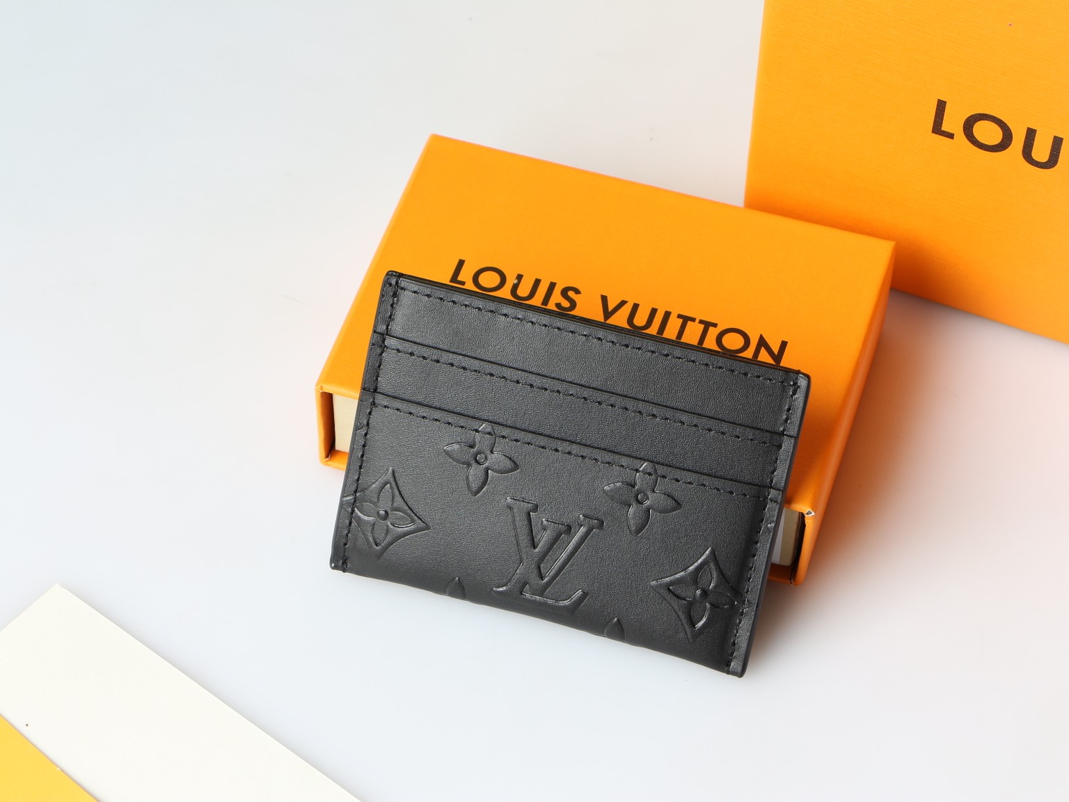 Monogram Eclipse card holder, front view, showcasing the stylish Monogram Eclipse pattern.