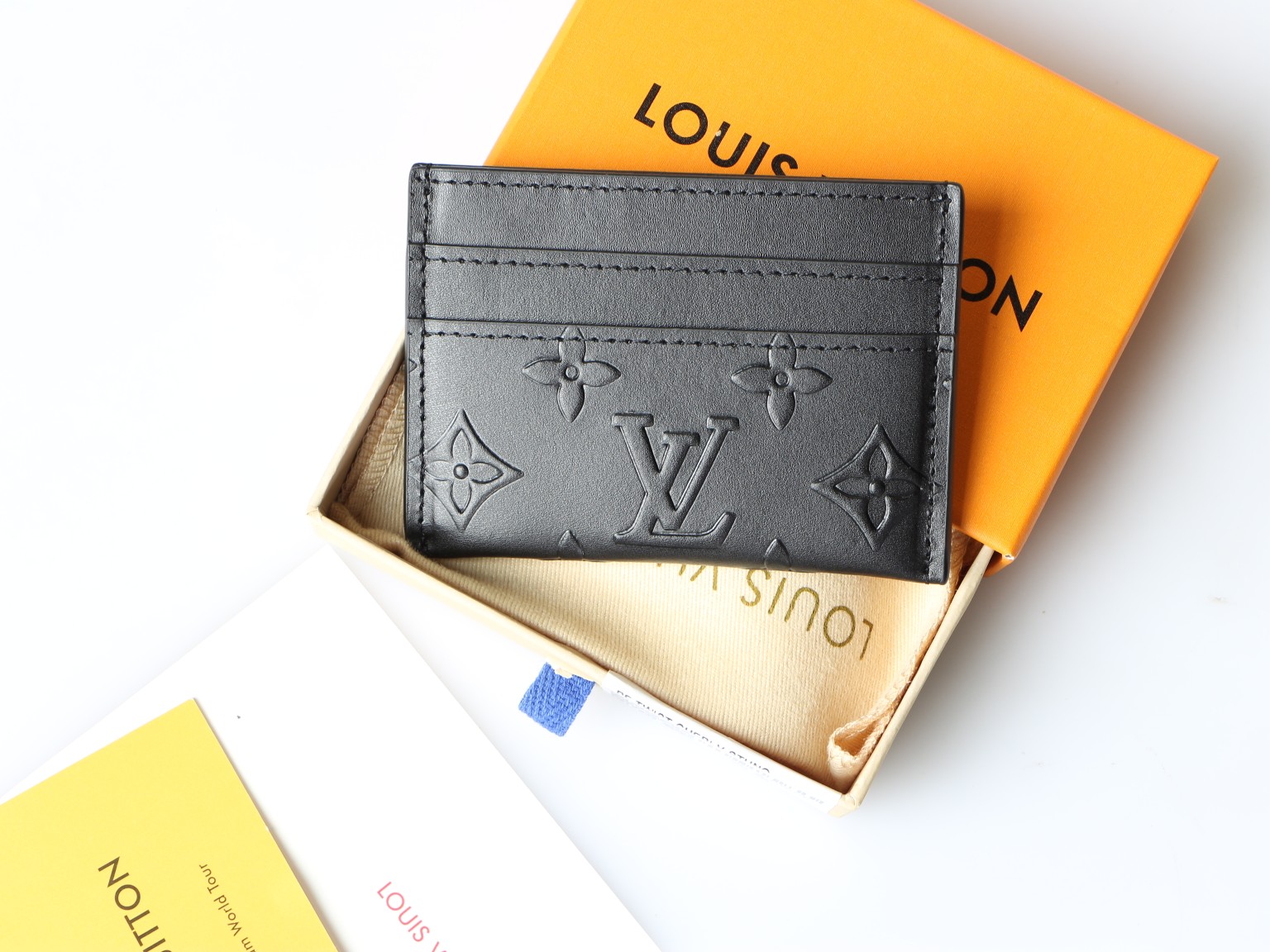 Close-up of the Monogram Eclipse card holder, highlighting the material's texture.