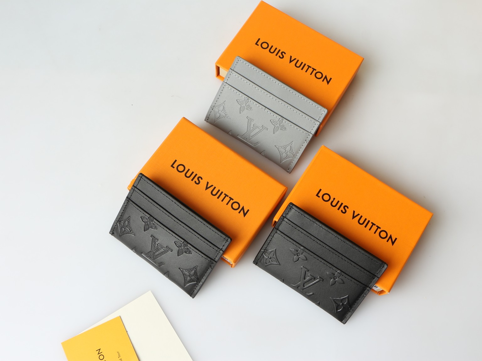 Monogram Eclipse card holder with credit cards, demonstrating capacity.