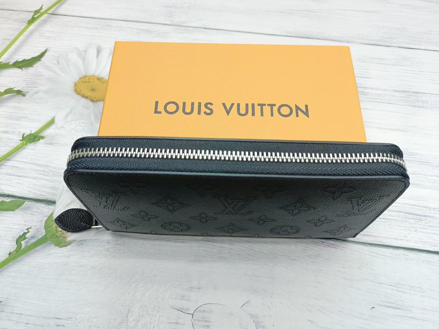 Long leather wallet in hand