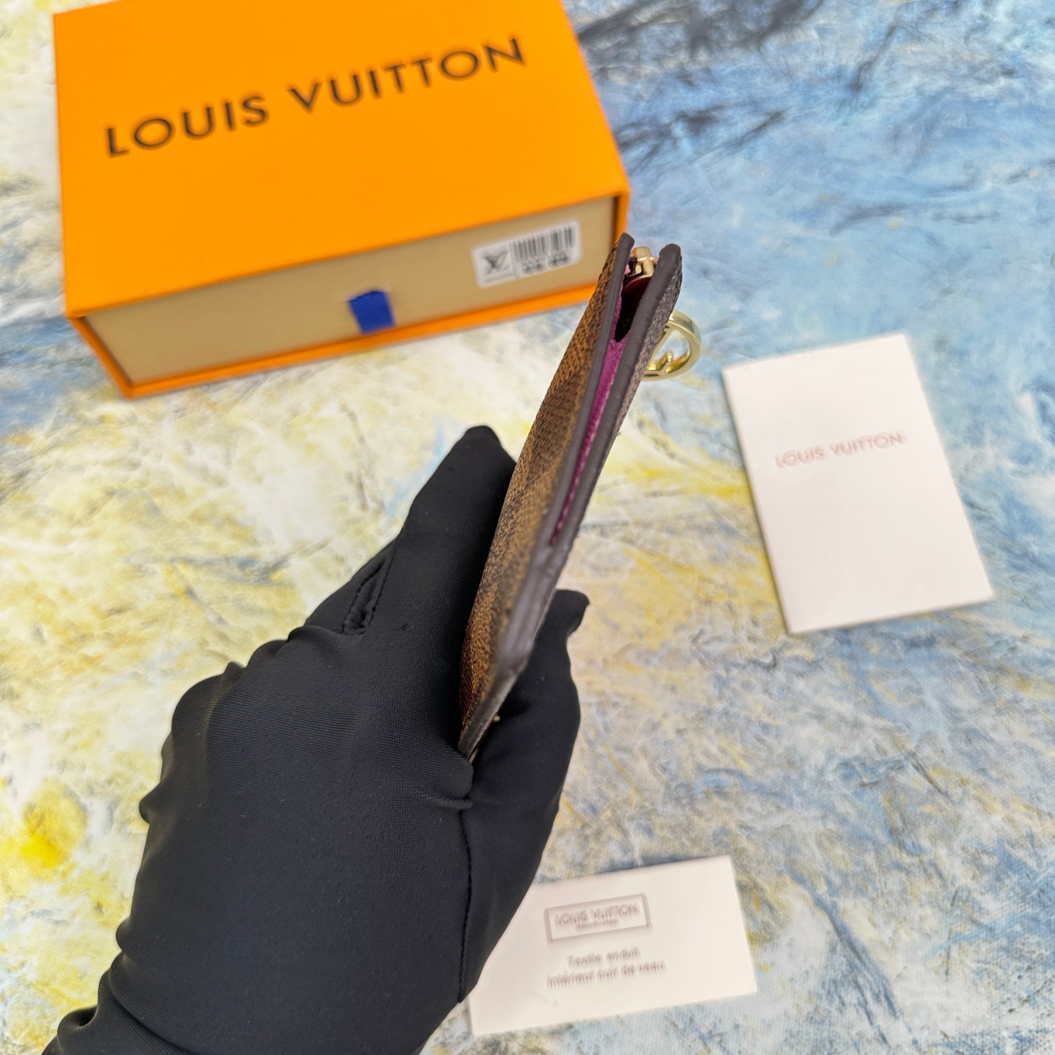 Leather card holder filled with cards