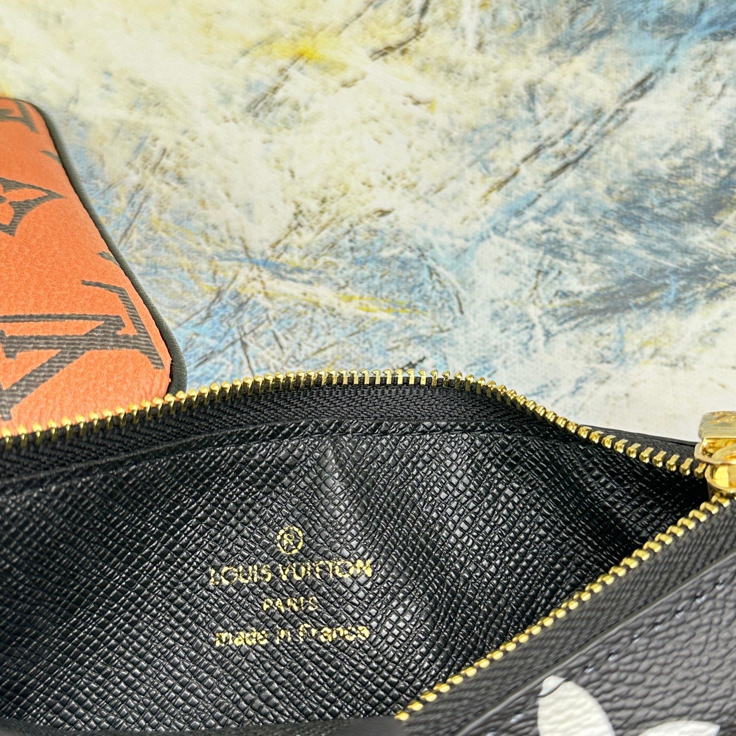 Leather wallet together with other leather goods.