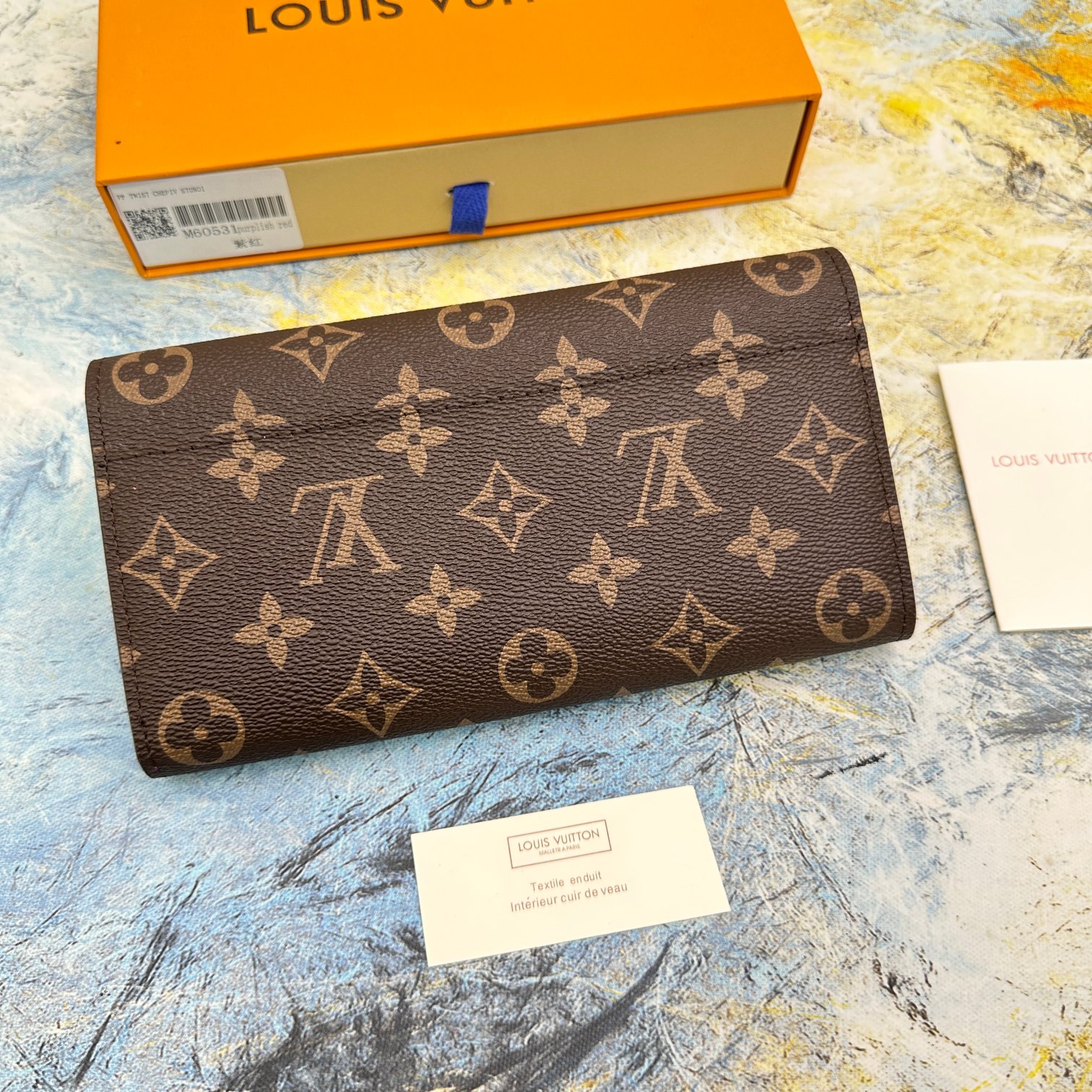 エレガントなモノグラム帆布製信封式財布