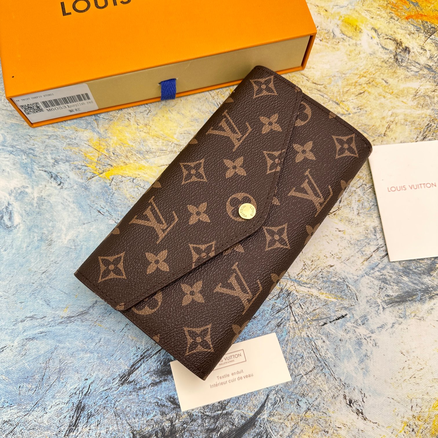 エレガントなモノグラム帆布製信封式財布