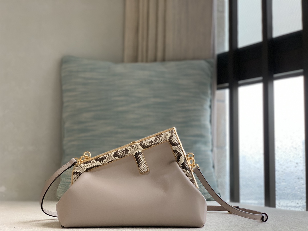 Fendi First series small series, made of lambskin, decorated with an oversized F metal buckle, and covered with luxurious python skin of the same