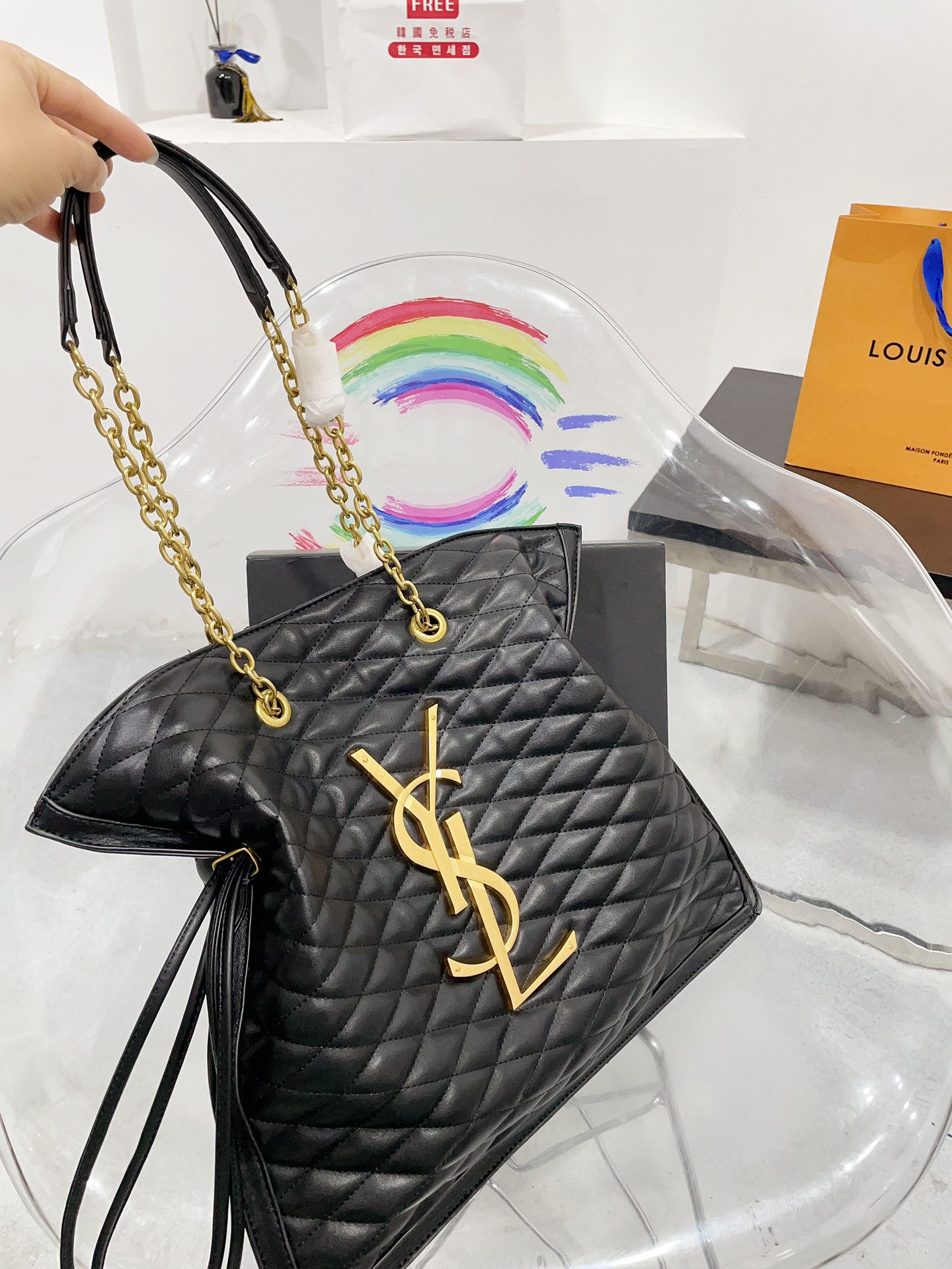 It comes with a boxed YSL shopping bag. It looks so pretty on my small waist. I love this bag so muc