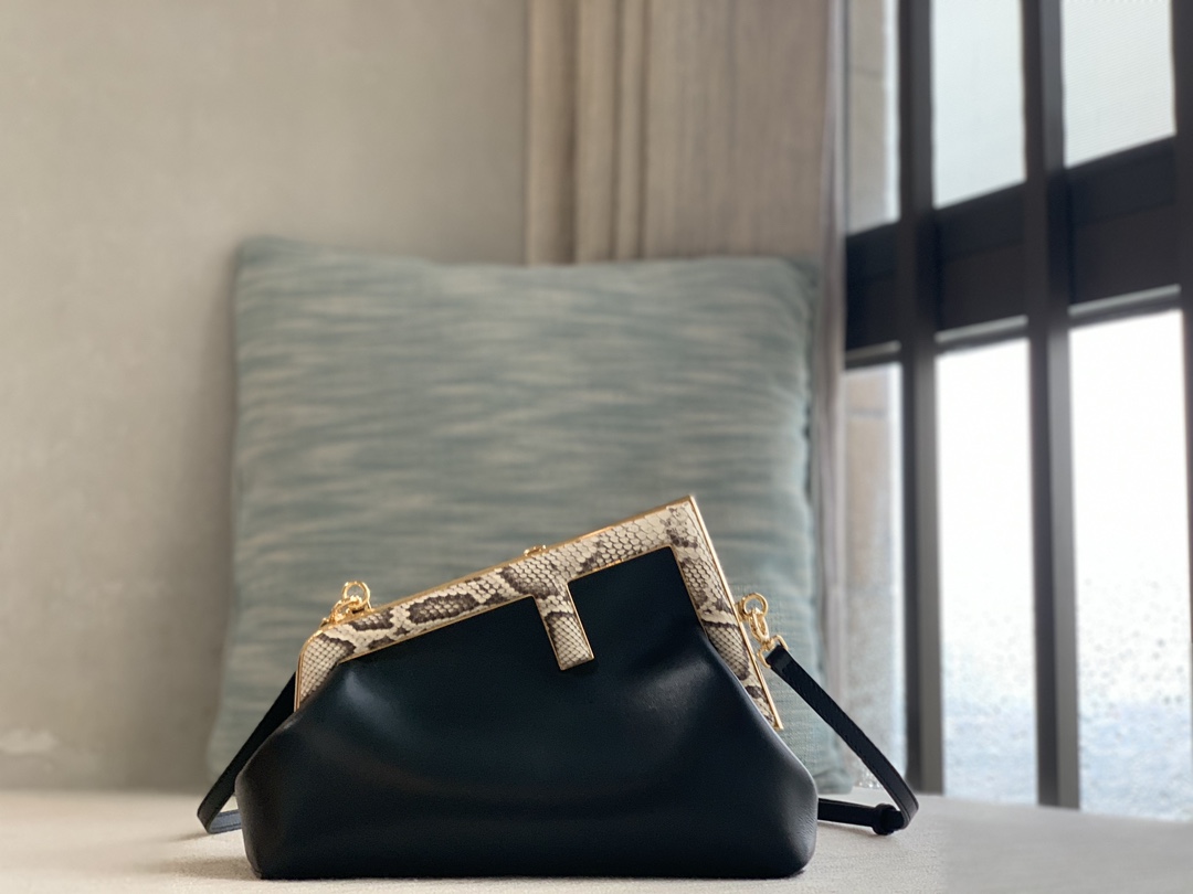 Fendi First series small handbag, made of lambskin, decorated with an oversized F metal buckle, and covered with luxurious python skin of the sam