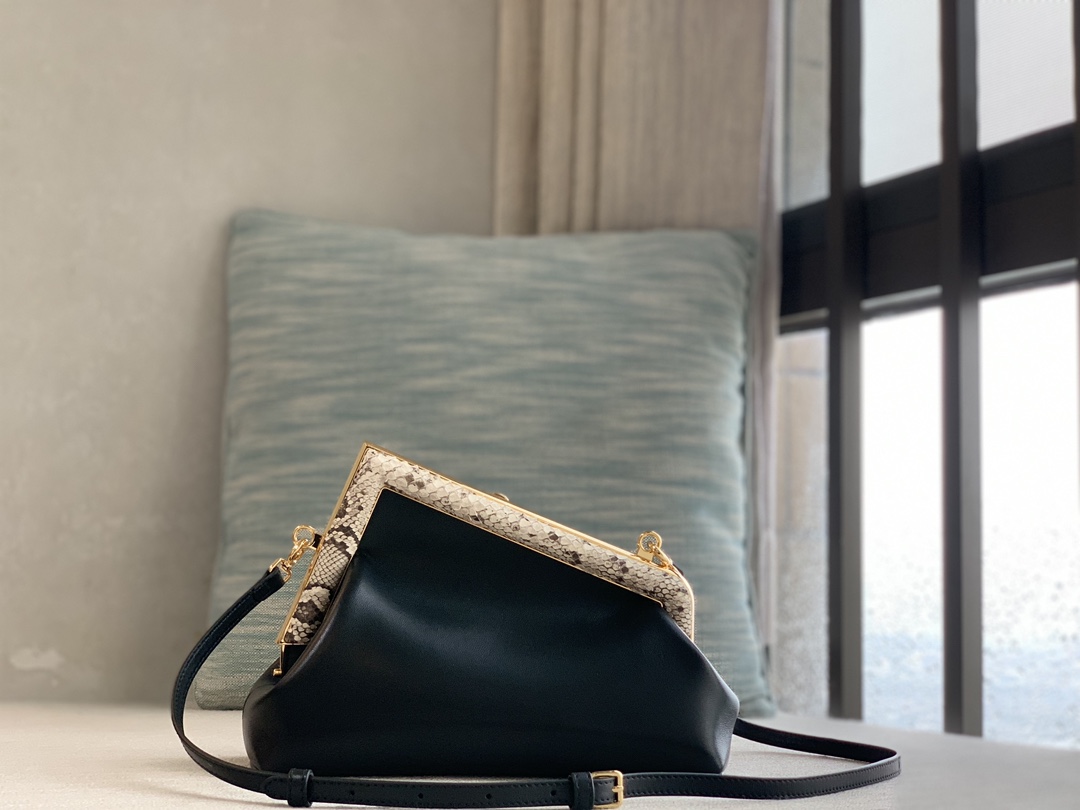 Fendi First series small handbag, made of lambskin, decorated with an oversized F metal buckle, and covered with luxurious python skin of the sam
