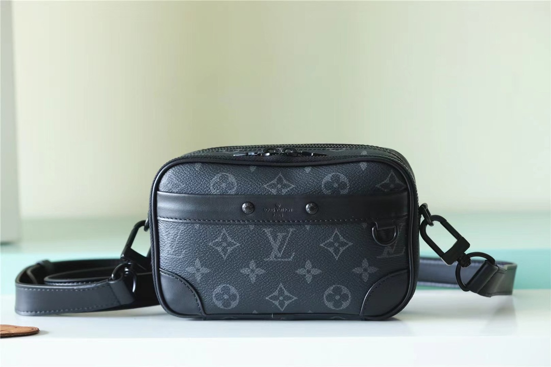 Its spacious interior features a zipped compartment and a front flat - Bag