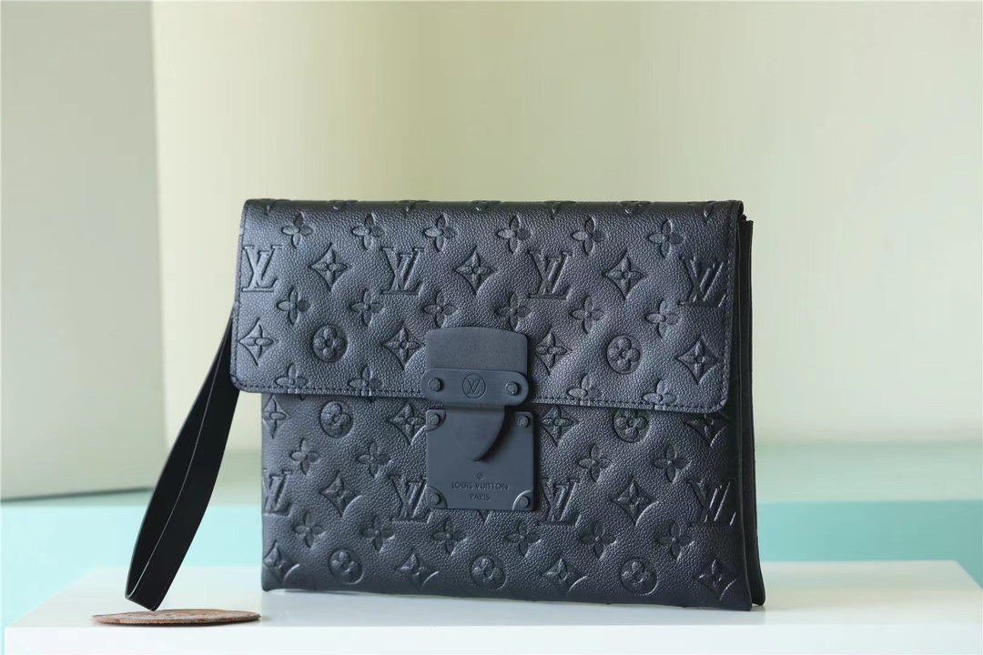 The Pochette S-Lock clutch is crafted from Monogram Eclipse canvas with - Bag