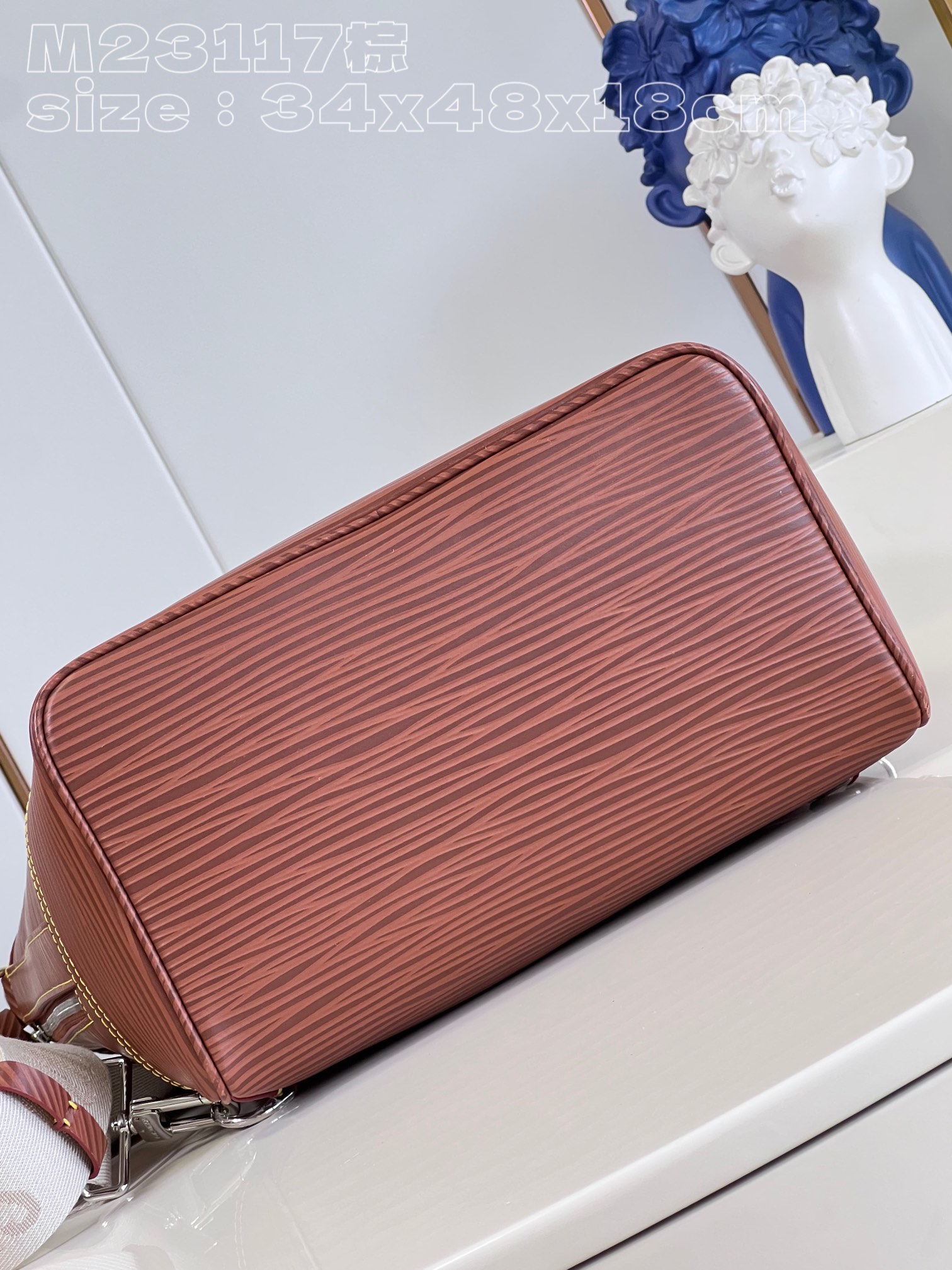 The bag features a spacious interior secured with a drawstring closure - Bag 7