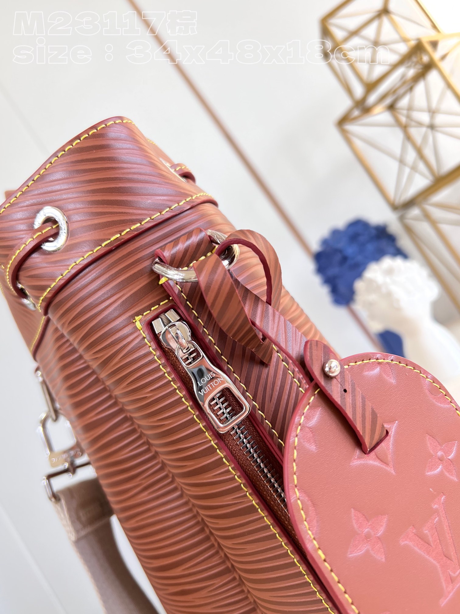 The bag features a spacious interior secured with a drawstring closure - Bag 5