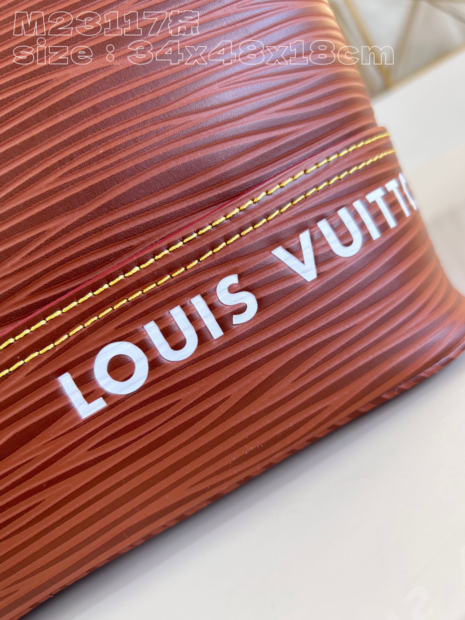 The bag features a spacious interior secured with a drawstring closure - Bag 2