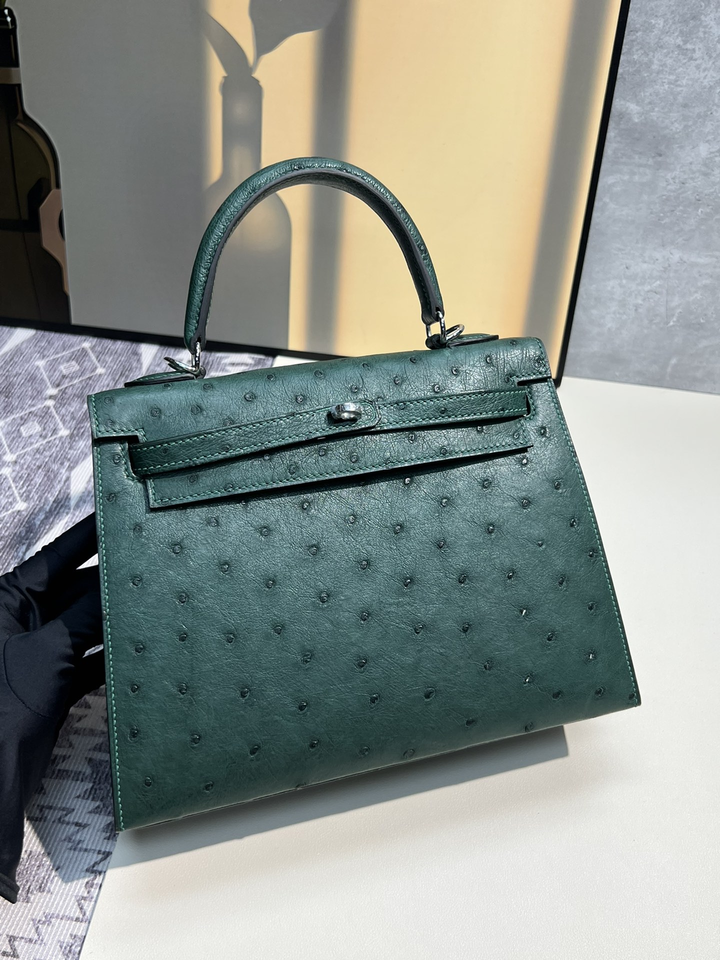Kelly 25, piel de avestruz, verde pino en stock