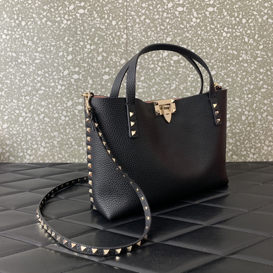 Valentino Garavani calfskin tote bag, decorated with iconic Rockstud decoration, roll-top handle, different contrasting styles on the inside and