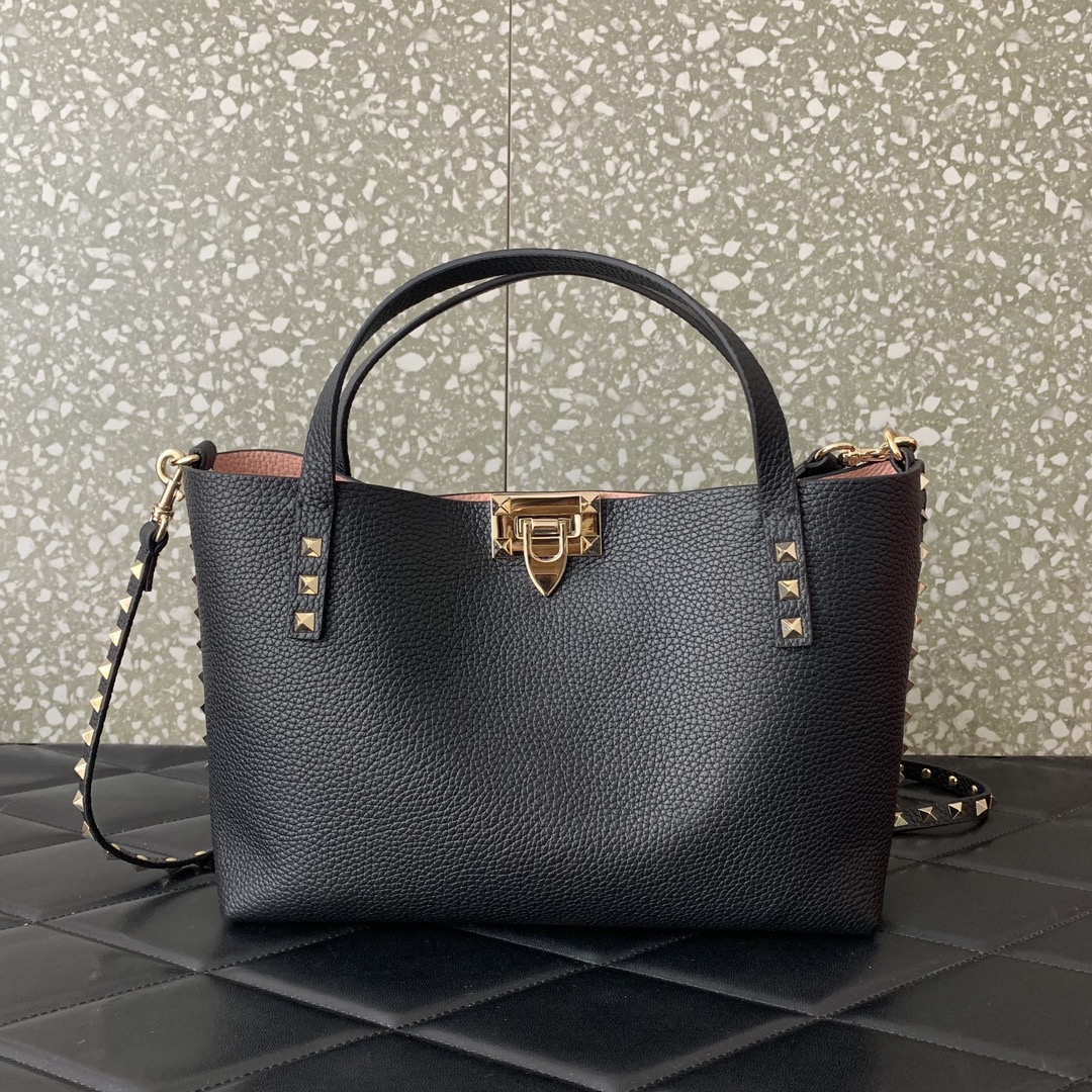 Valentino Garavani calfskin tote bag, decorated with iconic Rockstud decoration, roll-top handle, different contrasting styles on the inside and