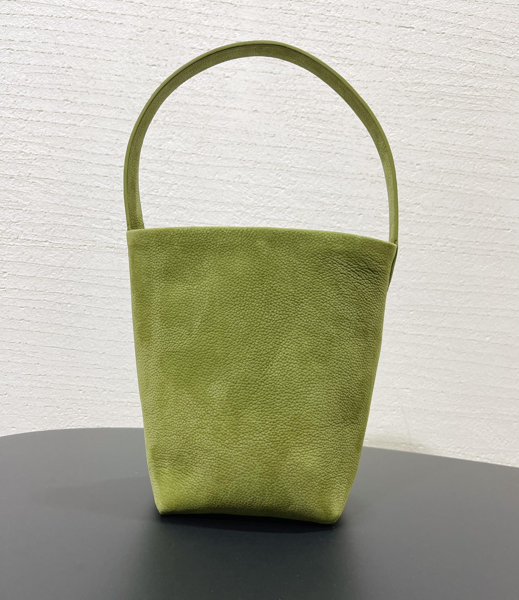 The Row suede bucket bag drawstring shoulder bag
